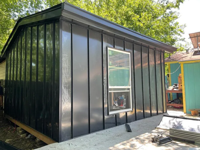 Black standing seam metal wall panels for Roof Inspection in Sawmills